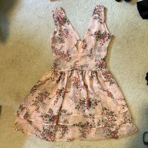 Pink V-neck dress with floral details